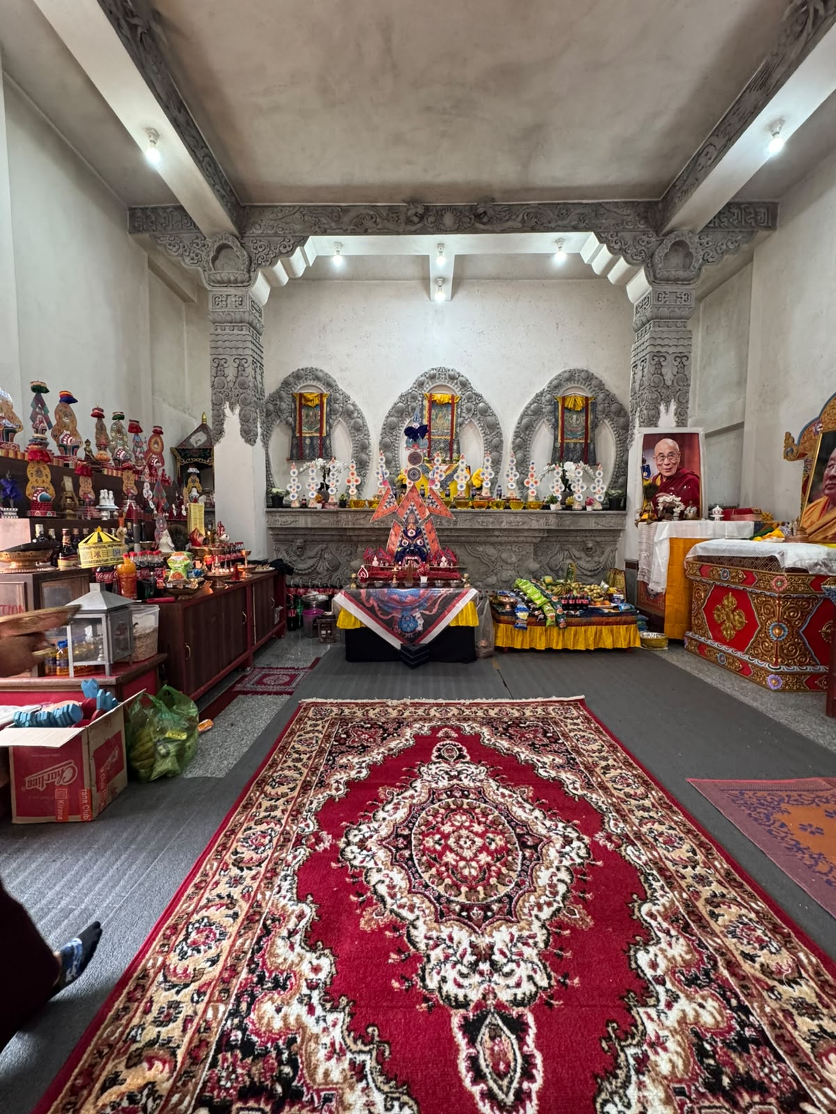Inside the shrine hall — altar, sacred thangkas and offerings