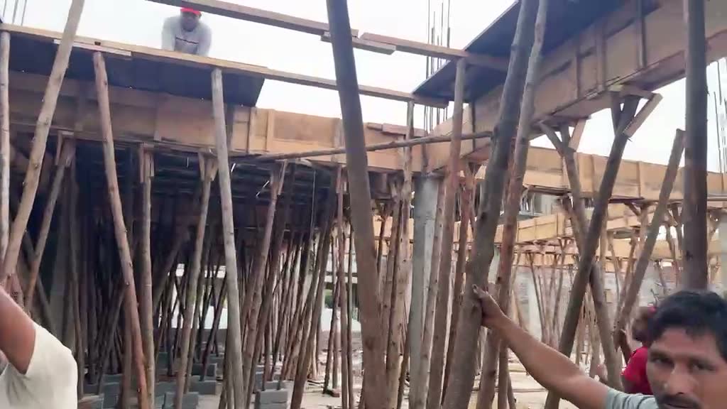 Workers building the new monastery buildings that need windows and doors
