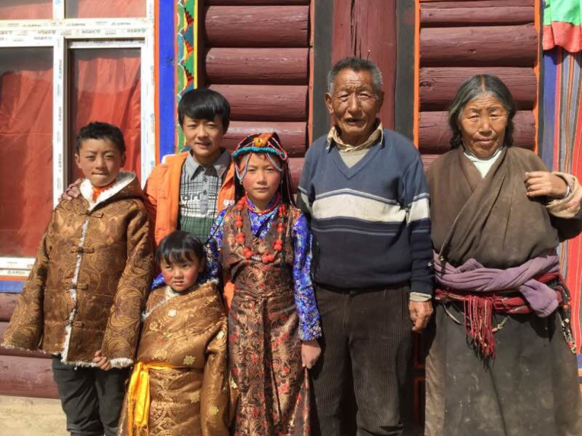 Geshe-la's family outside their home in Tibet — the loved ones he hopes to embrace again in Hong Kong