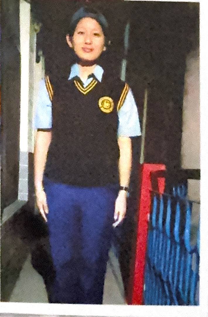 The girl Geshe Lobsan Gyaltsen raised as his own daughter, in her school uniform