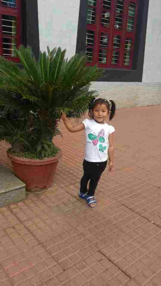 As a small child in the monastery courtyard