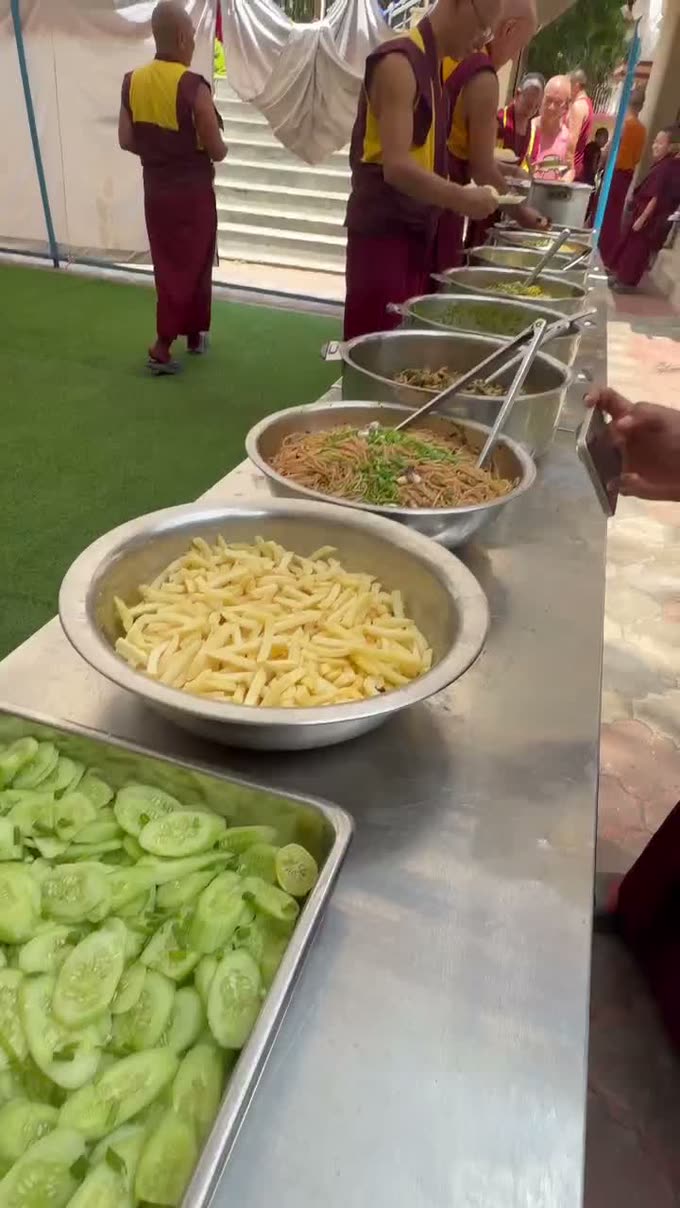 Bowls of noodles, greens and curd laid out for the assembly