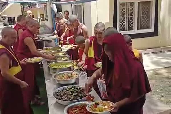 Monks of Sera Jey Tsangpa Khangtsen served food during the summer retreat